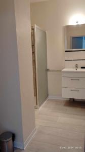 a white kitchen with a sink and a refrigerator at Studios ou Chambre SDB avec extérieur centre-ville Ribérac in Ribérac +34 photos
