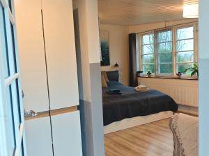 Postel nebo postele na pokoji v ubytování Ferienwohnung Diekblick - Kleiner Deichhof