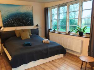 Postel nebo postele na pokoji v ubytování Ferienwohnung Diekblick - Kleiner Deichhof