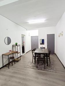 a dining room with a table and chairs at IRDINA HomestayMuslim's 2 at Emerald Avenue Brinchang Centrum in Brinchang