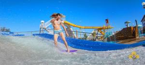 a man on a surfboard in the water at a water park at Resort do LAGO - Caldas Novas in Caldas Novas