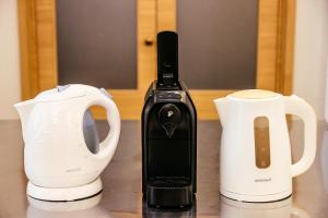 Coffee and tea making facilities at Apartmánový komplex Dagmar
