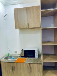Kuchyň nebo kuchyňský kout v ubytování Studio Apartment - Lekki Lagos + 2 fotografie