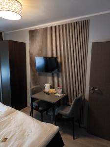 TV a/nebo společenská místnost v ubytování Löwen Hotel