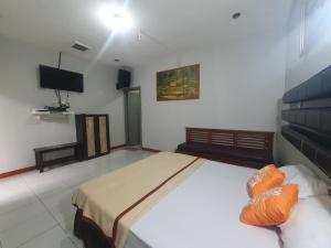 Postel nebo postele na pokoji v ubytování MDM Resort by Ruang Tidur