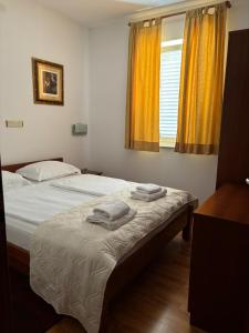 Postel nebo postele na pokoji v ubytování Apartments Šulekić