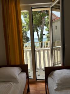 Postel nebo postele na pokoji v ubytování Apartments Šulekić