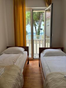 Postel nebo postele na pokoji v ubytování Apartments Šulekić