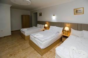Voodi või voodid majutusasutuse Pyramids Express View Hotel toas
