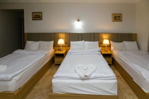 Voodi või voodid majutusasutuse Pyramids Express View Hotel toas