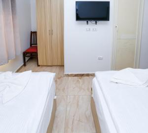 Voodi või voodid majutusasutuse Pyramids Express View Hotel toas