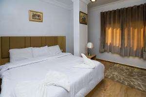 Voodi või voodid majutusasutuse Pyramids Express View Hotel toas