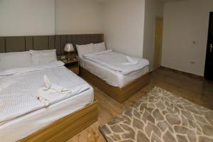 Voodi või voodid majutusasutuse Pyramids Express View Hotel toas