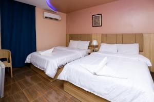 Voodi või voodid majutusasutuse Pyramids Express View Hotel toas