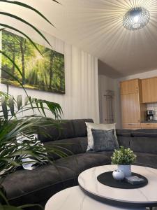 a living room with a couch and a table at Ferienhof Eckhoff in Fehmarn