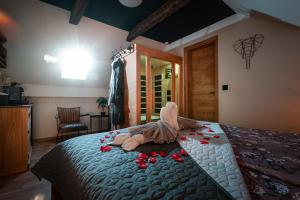 a bedroom with a bed with roses on it at Deluxe House Maj in Brežice