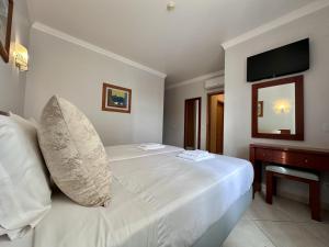 Postel nebo postele na pokoji v ubytování BayView Albufeira