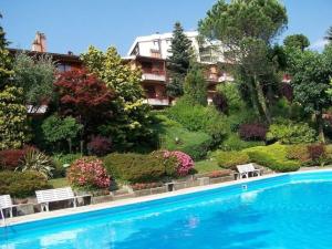 a large swimming pool in front of a building at Cordelia 6 in Luino