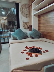 a bedroom with two beds with hearts on the bed at Artistic Loft Steps from the Beach with Pool View in Holbox Island +41 photos