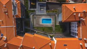 an overhead view of a building with orange roofs at Quintas Village AY by Atlantic Holiday in Caniço