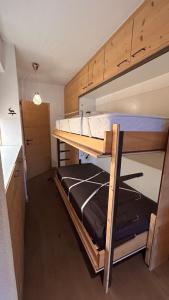 A bed or beds in a room at Ski-in and out in Thyon 2000