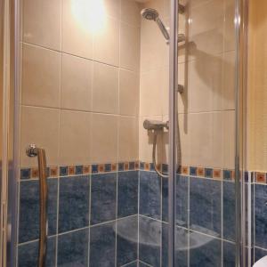 a shower with a glass door in a bathroom at George & Horn in Kingsclere +6 photos