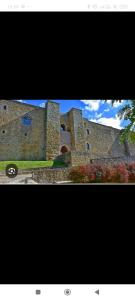 two pictures of a building with at Meson Cavour in Avigliano