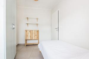Postel nebo postele na pokoji v ubytování Hisa Bubi