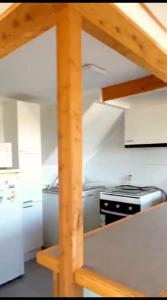 a kitchen with a stove and a counter top at Casa Chagre los molles Brisas del mar in Los Molles +9 photos