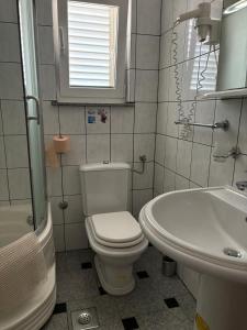 Koupelna v ubytování Apartments Šulekić