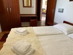 Postel nebo postele na pokoji v ubytování Apartments Šulekić