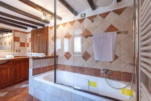 a bathroom with a shower and a bath tub at Artist's Suites in Spoleto +40 photos
