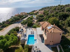 an aerial view of a house with a swimming pool at Villa Niki with swimming pool in Kefallonia
