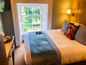 Voodi või voodid majutusasutuse Avalon House Hotel toas