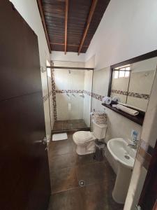 a bathroom with a toilet and a sink at Apartamento Relax in Medellín