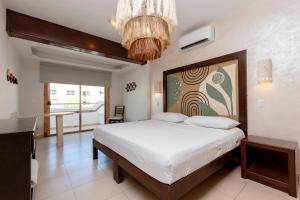 Cama ou camas em um quarto em Hotel Kinich