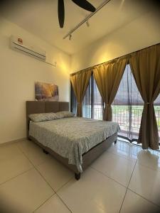 a bedroom with a bed and a large window at horizon ipoh in Ipoh