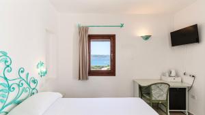 Postel nebo postele na pokoji v ubytování Hotel Villa Gemella + 37 fotografií