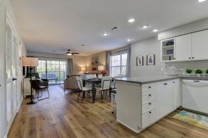 a kitchen and dining room with a table and chairs at Luxurious Condo at Holiday Hills Resort - Beautifully Updated and Affordable - Family Amenities - No Steps in Branson