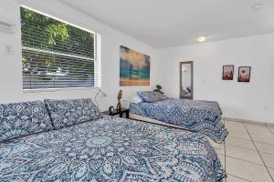 Postel nebo postele na pokoji v ubytování Boho Studio in Little Havana
