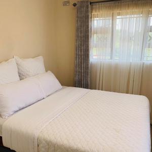 Ένα ή περισσότερα κρεβάτια σε δωμάτιο στο Framans Holiday Home