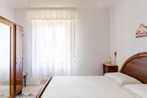 A bed or beds in a room at Villa Isabella