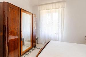 A bed or beds in a room at Villa Isabella