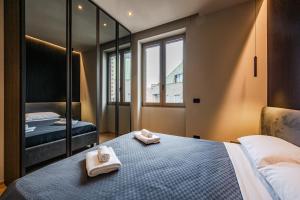 A bed or beds in a room at Luxury Suite with View Steps from the Duomo
