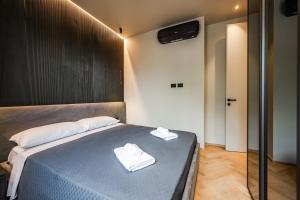 A bed or beds in a room at Luxury Suite with View Steps from the Duomo