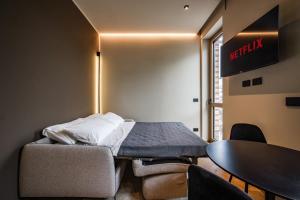A television and/or entertainment centre at Luxury Suite with View Steps from the Duomo