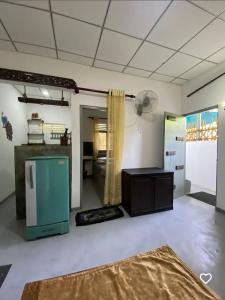 a living room with a room with a fan at Dolce Vita Villa Ahangama in Ahangama