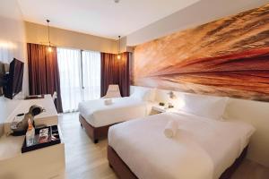 Postel nebo postele na pokoji v ubytování Maxx Hotel Makati