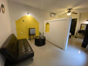 a living room with a couch and a table at Quinta Marciala Hotel Boutique in Valladolid