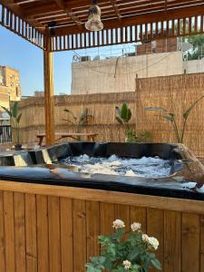 a large hot tub with water in it on a patio at Luxury apartment with private balcony 1007 in Cairo